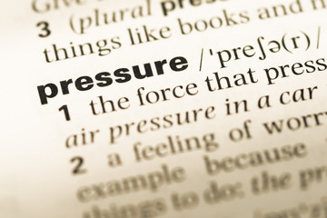 Wall Mural - close up of old english dictionary page with word pressure