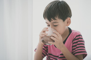 Little boy drinking milk vintage color style