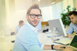© goodluz - Businessman with eyeglasses working in office