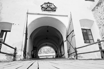 Metal gates of old castle Palanok, arch entrance gate. Mukachevo