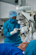 © DragonImages - Doctor conducting surgery on eye of senior patient