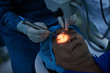 © DragonImages - Close-up image of ophthalmologist ready to perform surgery