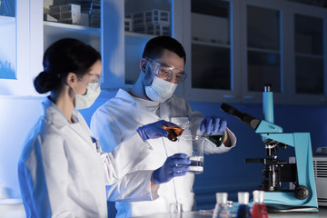 close up of scientists making test in lab