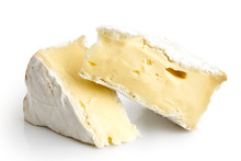 Two Pieces Of White Mould Cheese Isolated On White.
