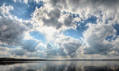 Wall Mural - rays of sun shining through the clouds.