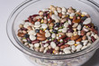 Dried colorful beans in a clear bowl