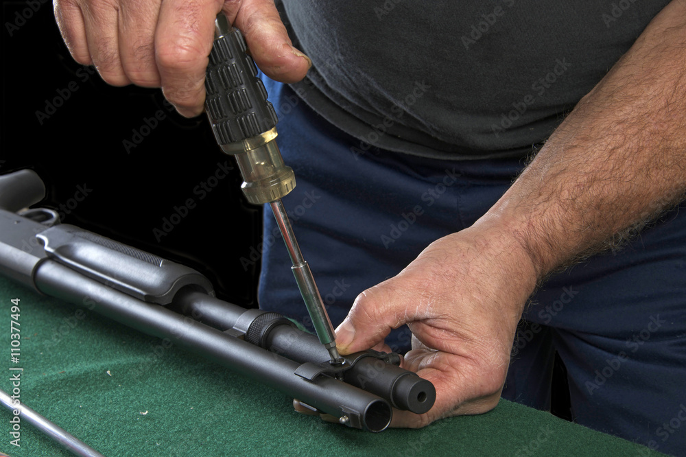 Gunsmith replacing clamp to barrel on 20 gauge pump action shotgun ...
