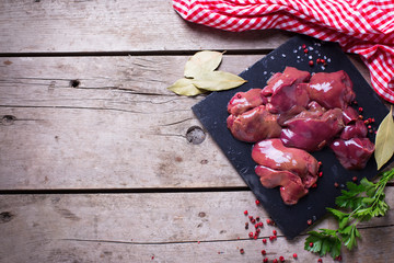 Wall Mural - Raw chicken liver on slate board