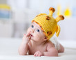 © Oksana Kuzmina - funny baby weared giraffe hat