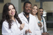 © halid994 - Group of young medical workers are working in lab as lab technic