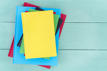 Offset stack of multicolored hardcover books