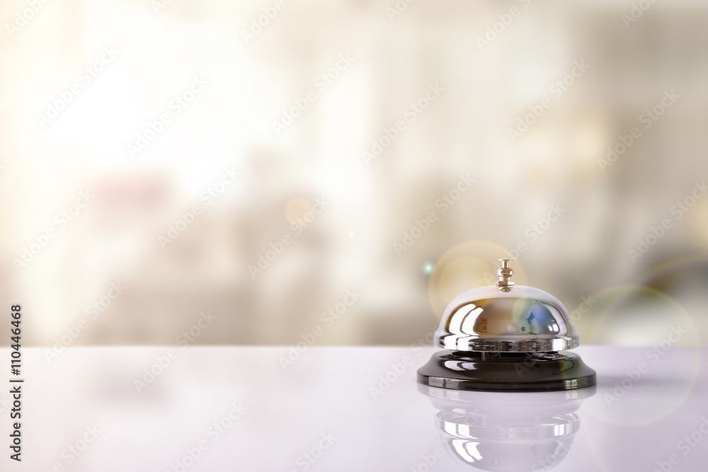 Service bell on hotel reception with Hotel background - obrazy, fototapety, plakaty 