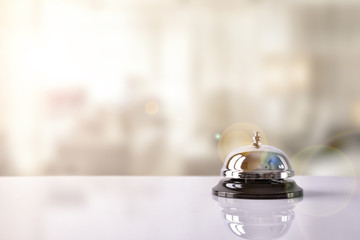service bell on hotel reception with hotel background