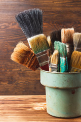 Different brushes in the bucket