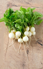 Wall Mural - white radishes on wooden surface