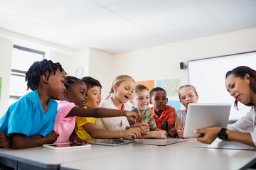 A teacher giving lesson with tablet computer