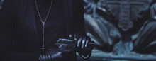 Close-up Hands Of Girls In Black Leather Gloves, Grip Gun