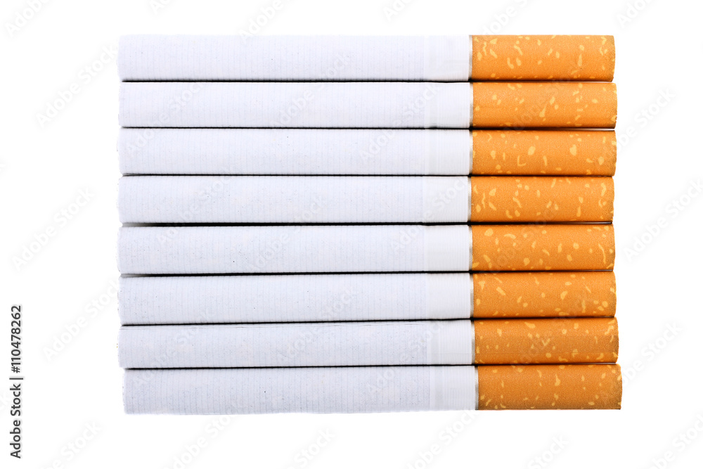Cigarette with an orange filter lie close to each other isolated on white  background Stock Photo