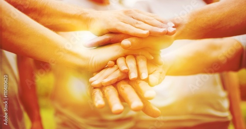 Cuadros en Lienzo Happy volunteer family putting their hands together