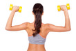 Working those biceps. Shot of a beautiful young woman exercising with dumbbells against white isolated background.