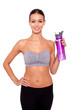 Water - an important part of my workout. An isolated portrait of a sporty young woman holding a bottle of water