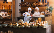 Bakery Staff Offering Bread
