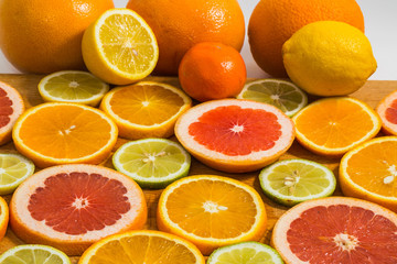 Wall Mural - Citrus fruit background with sliced f oranges lemons lime tanger