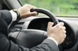 © tesphoto - Businessman driving his  car.