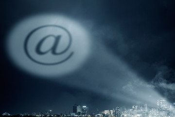 email symbol in dark sky