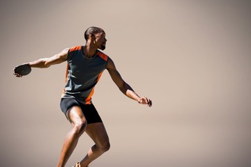 composite image of athlete man throwing a discus