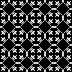 Canvas Print - forged seamless pattern of white fleur-de-lis on a black background. openwork metal fence design. mo