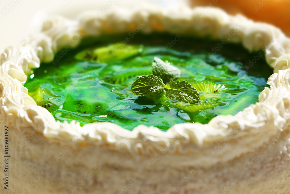 Fresh homemade cake with sliced kiwi, close up