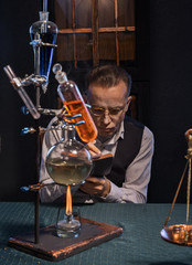 The scientist - a chemist invents new drugs in vintage office