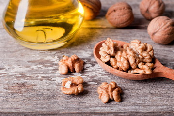 Wall Mural - walnut kernel in a wooden spoon