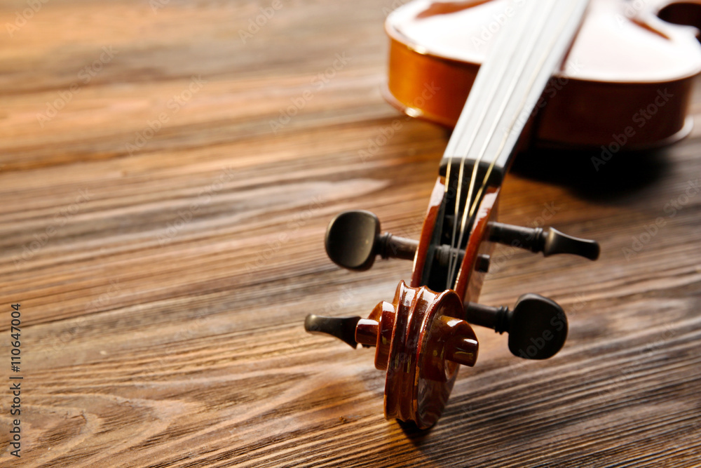 Violin on wooden background