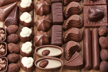 Canvas Print - Assortment of delicious chocolate candies background, close up