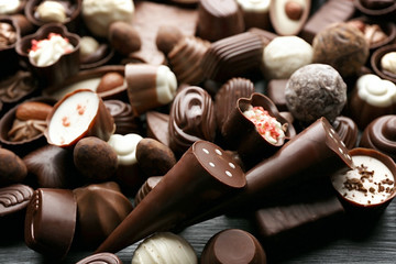 Canvas Print - Assortment of delicious chocolate candies background, close up