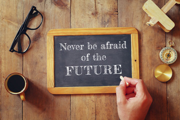 Wall Mural - man writes a phrase: NEVER BE AFRAID OF THE FUTURE