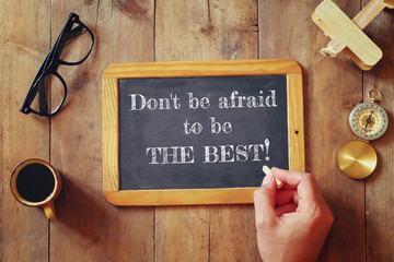 Wall Mural - man writes a phrase: DON'T BE AFRAID TO BE THE BEST