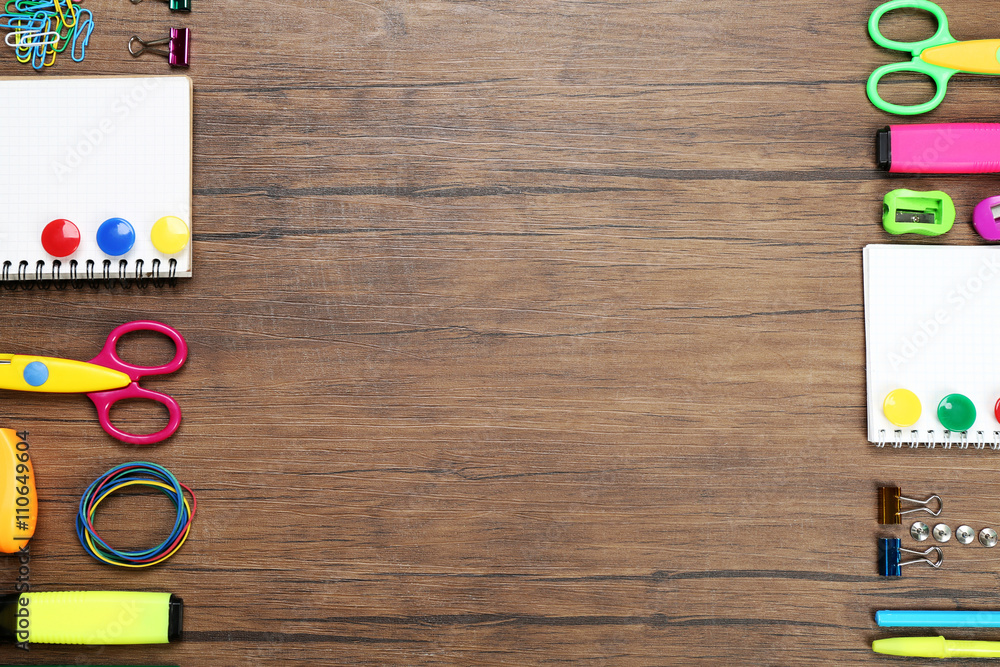 Frame of stationery on wooden background