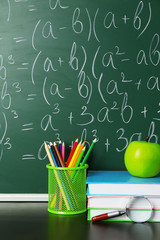 Poster - School books on desk near chalkboard