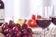 © Africa Studio - Glasses of red wine with food on blurred background