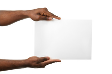 Wall Mural - Male hands holding sheet of paper isolated on white