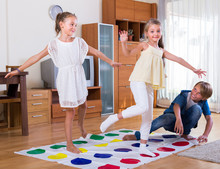 Children Playing Twister At Home.