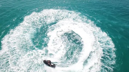 Wall Mural - Jet skiing in open waters - Aerial footage