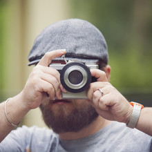 Young Stylish Photographer With Vintage Camera