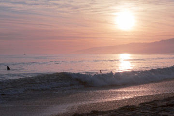 Wall Mural - The Pacific ocean during sunset. Landscape with blue sea, the mountains and the dusk sky, the USA, Santa Monica. 