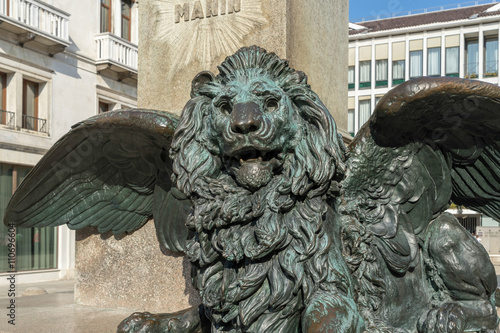Winged Lion beneath the statue of Daniele Manin in venice Poster
