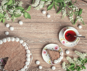 chocolate  cake and cherry flowers on the wooden table with luxu