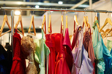 Evening Dresses Hang On A Shelf In Store